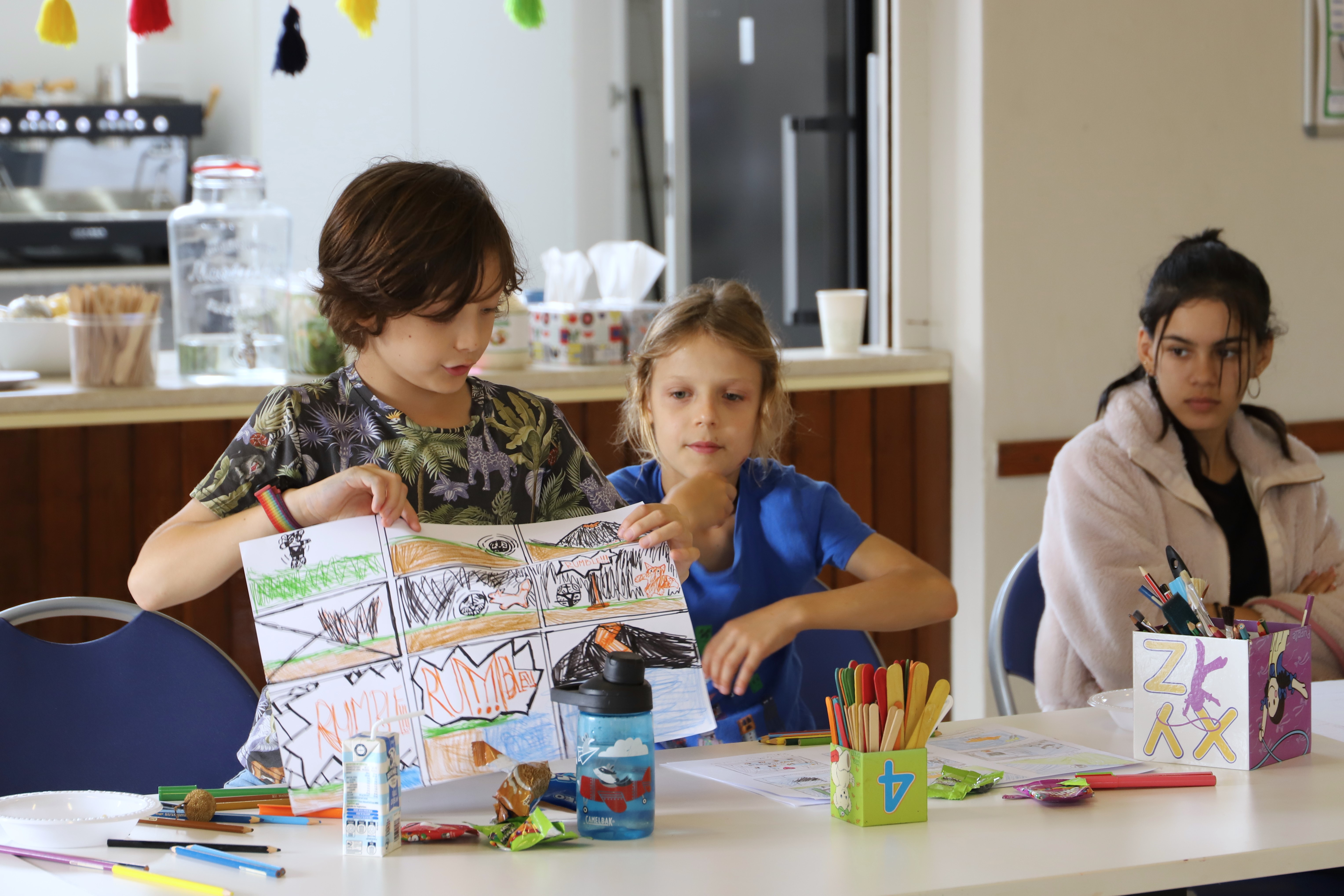 Close up of participants crafting props at the Community Refugee Welcome Centre